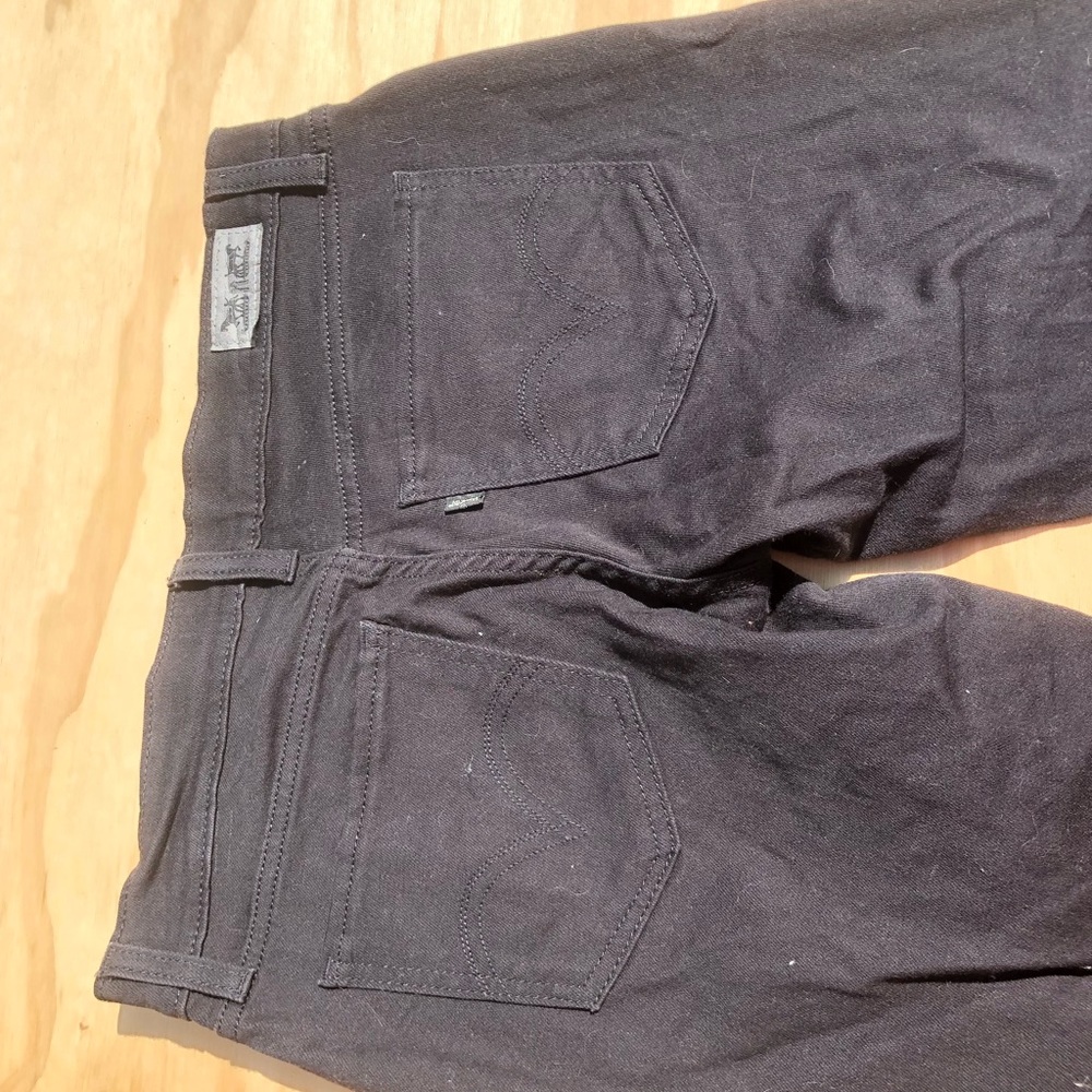 Levi black jeans with silver studs on pockets